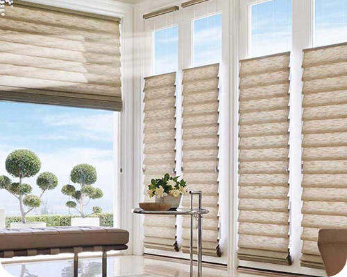 A modern loungeroom featured Hunter Douglas Luxaflex blinds.