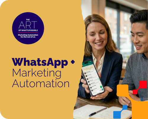 Two marketers at a desk looking at WhatsApp on a mobile device.
